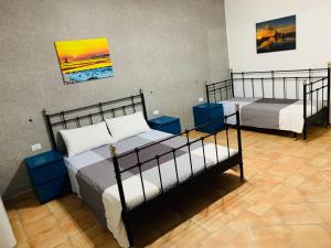 Postel nebo postele na pokoji v ubytování B&B Tramonti d'aMare