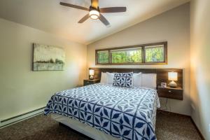 a bedroom with a bed and a ceiling fan at Ephraim Motel in Ephraim