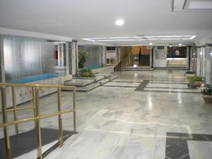 a hallway of a building with stairs and a lobby at Jupiter Apartments Sea View in Benalmádena