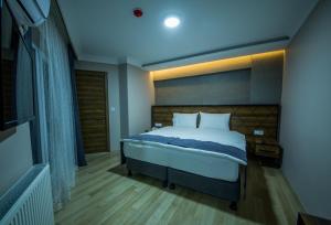 Postel nebo postele na pokoji v ubytování Fidanoglu Suite Hotel