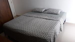 Postel nebo postele na pokoji v ubytování Apartamento Residencial Julia