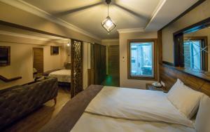 Postel nebo postele na pokoji v ubytování Fidanoglu Suite Hotel