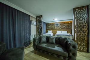 Postel nebo postele na pokoji v ubytování Fidanoglu Suite Hotel
