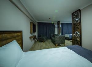Postel nebo postele na pokoji v ubytování Fidanoglu Suite Hotel