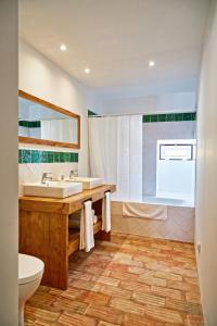 a bathroom with a sink and a toilet at Casa de Veiros - Estremoz in Estremoz
