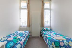 Ένα ή περισσότερα κρεβάτια σε δωμάτιο στο BK Hostel