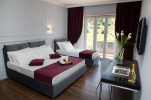 Кровать или кровати в номере Unicum Roma Suites