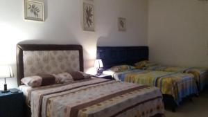 A bed or beds in a room at La Esperanza