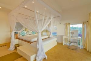 Кровать или кровати в номере The Palm Residence by Amazing Zanzibar