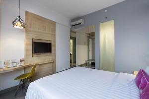 Un ou plusieurs lits dans un hébergement de l'établissement Laska Hotel Subang