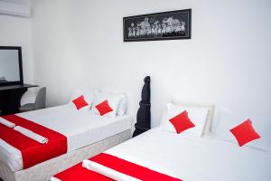 Postel nebo postele na pokoji v ubytování Lion Resort