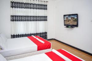 Postel nebo postele na pokoji v ubytování Lion Resort