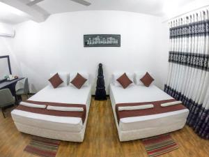 Postel nebo postele na pokoji v ubytování Lion Resort