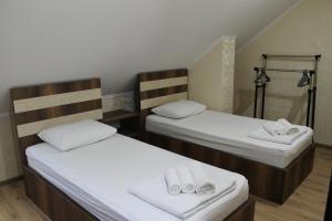 Postel nebo postele na pokoji v ubytování Hotel Lion