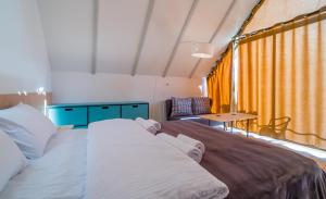 A bed or beds in a room at Kazbegi View