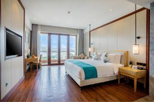 Телевизор и/или развлекательный центр в Sanya Dadonghai Seaview Hotel