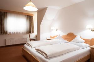 A bed or beds in a room at Residence La Selva