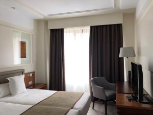 Postel nebo postele na pokoji v ubytování Hotel Olid