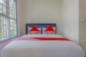 Postel nebo postele na pokoji v ubytování OYO 39077 Guesthouse