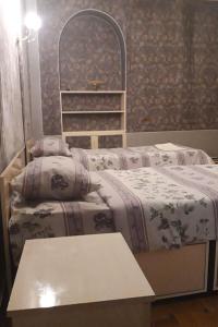 Postel nebo postele na pokoji v ubytování Royal Boutique Hotel on Kievyan