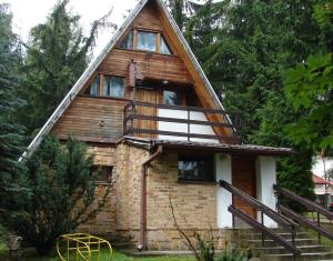 a house with a gambrel roof with a staircase at Bogdanówka Karpacz - Twój Dom w Karkonoszach in Karpacz