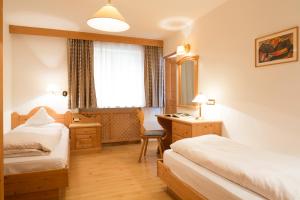 A bed or beds in a room at Residence La Selva