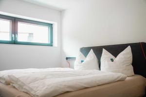 Voodi või voodid majutusasutuse BikeHikeSleep Apartments toas