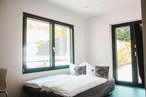 Voodi või voodid majutusasutuse BikeHikeSleep Apartments toas