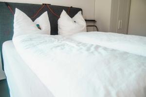 Voodi või voodid majutusasutuse BikeHikeSleep Apartments toas