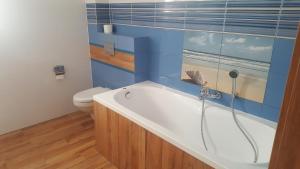 Kúpeľňa v ubytovaní Apartamenty Kapitanskie