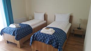 Posteľ alebo postele v izbe v ubytovaní Apartamenty Kapitanskie