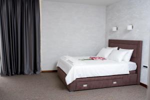 A bed or beds in a room at IPN APARTMENTs