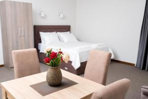 A bed or beds in a room at IPN APARTMENTs