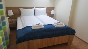 Posteľ alebo postele v izbe v ubytovaní Apartamenty Kapitanskie