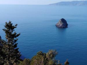 an island in the middle of a large body of water at Bike&Boat Argentario Hotel in Porto Santo Stefano