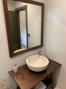 a bathroom with a sink and a mirror at Iliovasilema in Platy