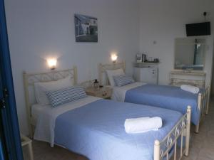 Letto o letti in una camera di Hotel Flisvos