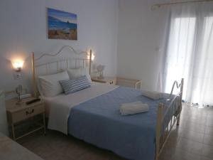 Letto o letti in una camera di Hotel Flisvos