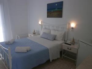 Letto o letti in una camera di Hotel Flisvos