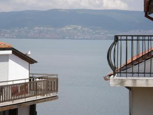 
a view from a balcony of a building overlooking a body of water at Emona Guest House in Nesebar
