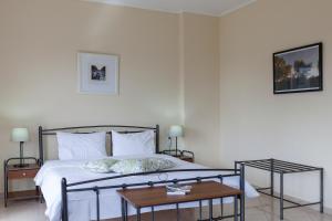 Postel nebo postele na pokoji v ubytování Hotel Marathia