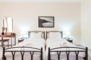 Postel nebo postele na pokoji v ubytování Hotel Marathia