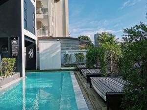 a swimming pool in the middle of a building at Blu Monkey Hub and Hotel Phuket Town- Free All Day Coworking space in Phuket Town