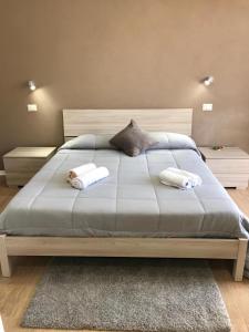 Postel nebo postele na pokoji v ubytování Luxury Suite terrazze e vista mare