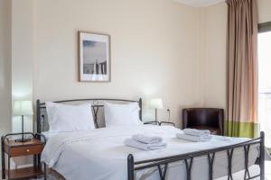 Postel nebo postele na pokoji v ubytování Hotel Marathia