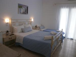 Letto o letti in una camera di Hotel Flisvos