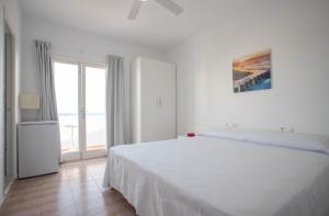 Posteľ alebo postele v izbe v ubytovaní Hostal Mayans