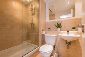 a bathroom with a shower and a toilet and a sink at Host & Stay - Oldham Place in Liverpool