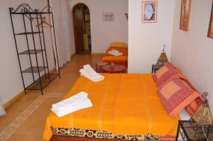 Letto o letti in una camera di Casa Naima