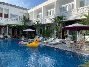 a pool with a rubber duck in the middle of a hotel at Laverder Resort in Phú Quốc